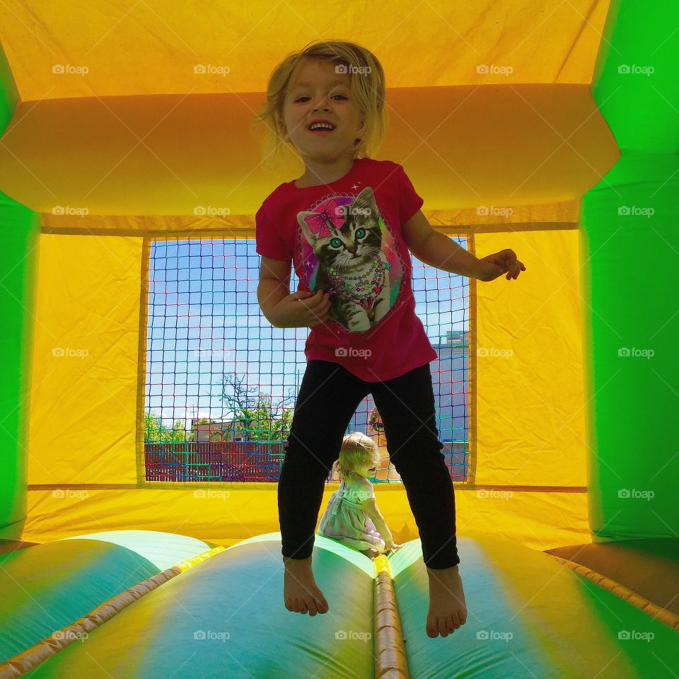 Bouncing Little Lady . Spring time and bouncing in the bounce house at the YMCA during healthy kids day