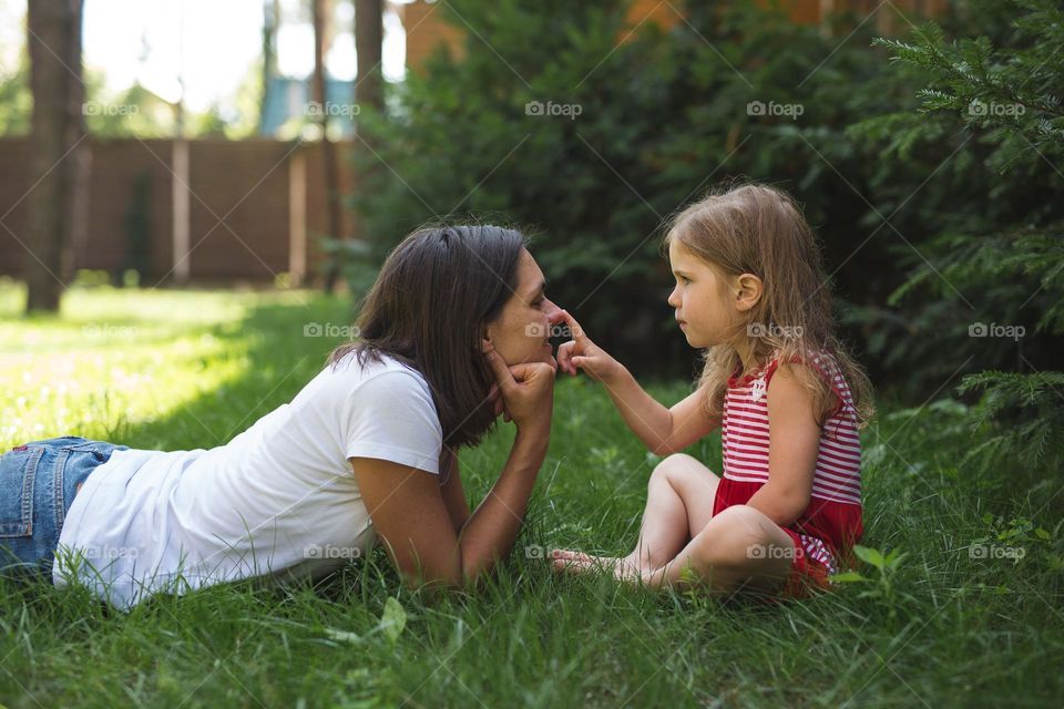 Tenderness moment, mom and daughter 