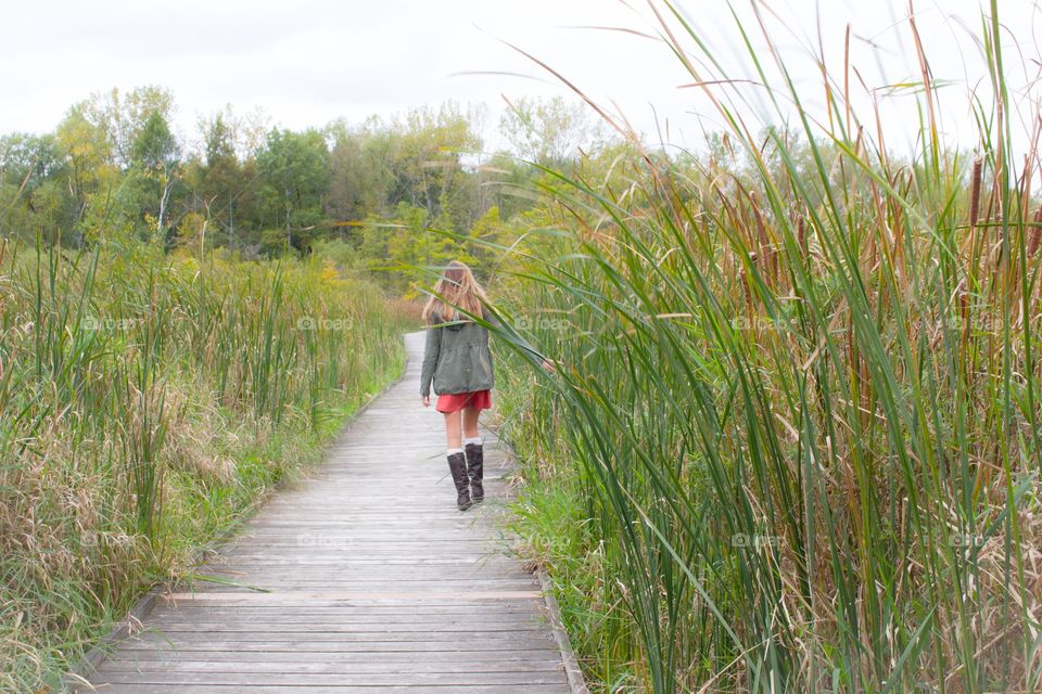 Strolling down a boardwalk 