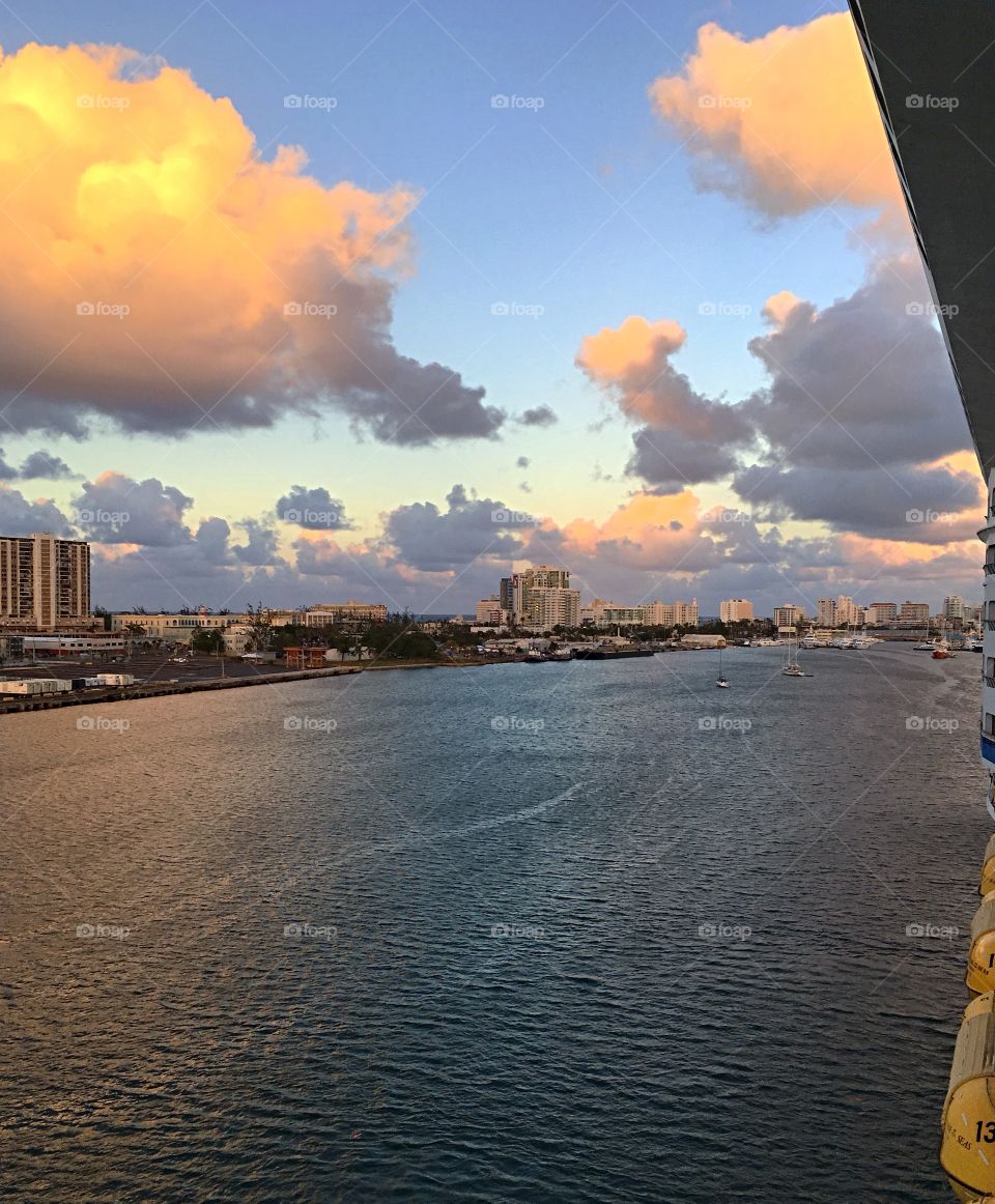 Sunset in San Juan.  A beautiful last shot of the city as we depart on our cruise for the next week.  Big puffy clouds lit up Golden from the setting sun. 