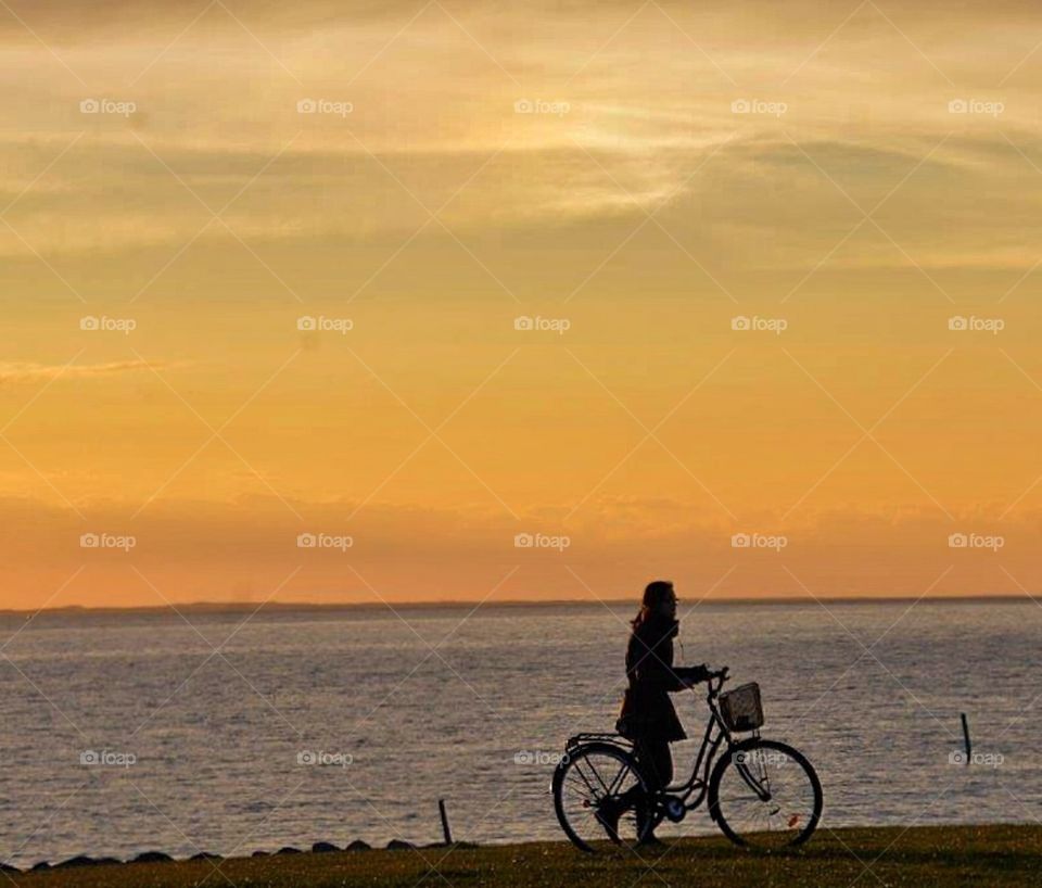 Girl & bike in sunset