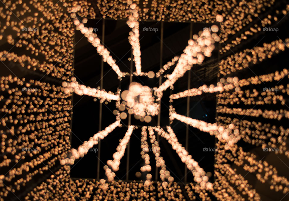 I was wandering in a shopping mall and found this wonderful golden chandelier in the middle of the atrium.