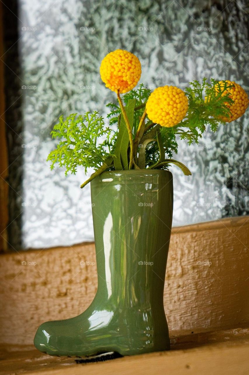 Green Rain Boot Vase with Yellow Flowers