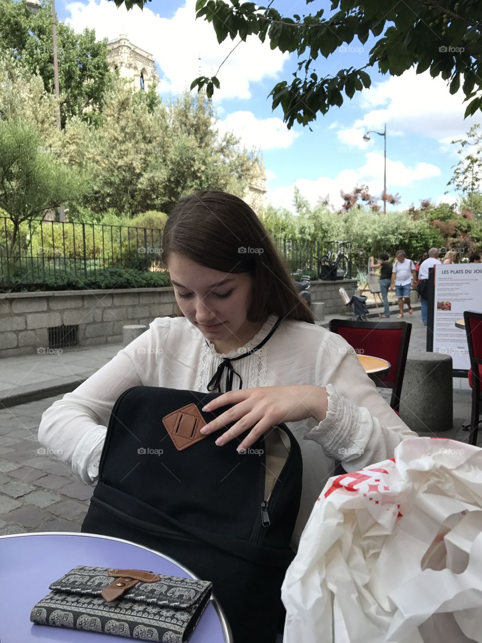 Woman searching in her bag