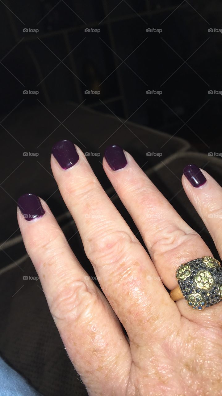 Dark purple manicure with fancy cocktail ring