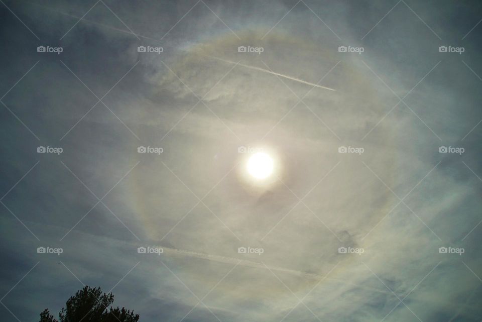 Rainbow around the sun during eclipse