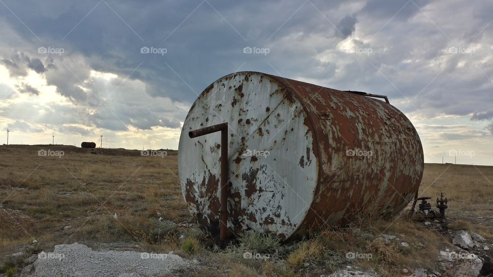 Scenery with an abandoned tank