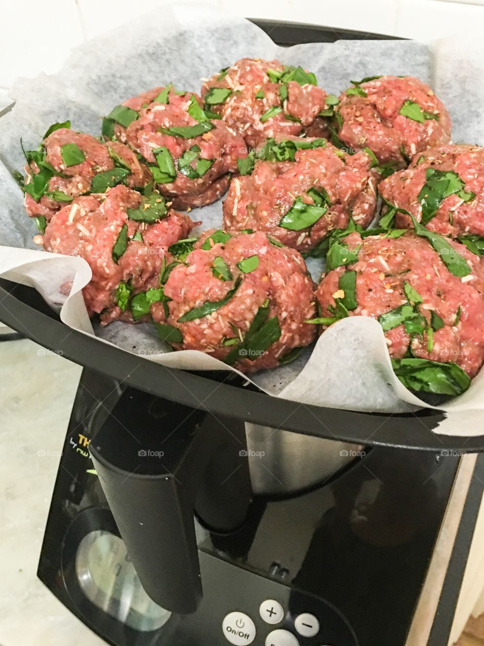 Newest trend in cooking, thermo machines, here with the steamer attachment cooking Italian meatballs 