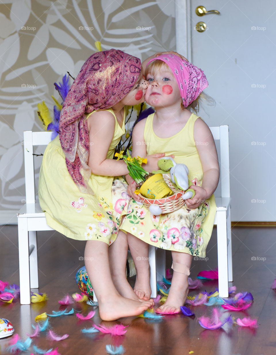 Cute sibling kissing in home