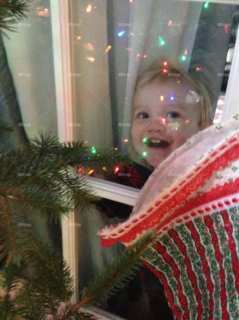 Girl looking through window