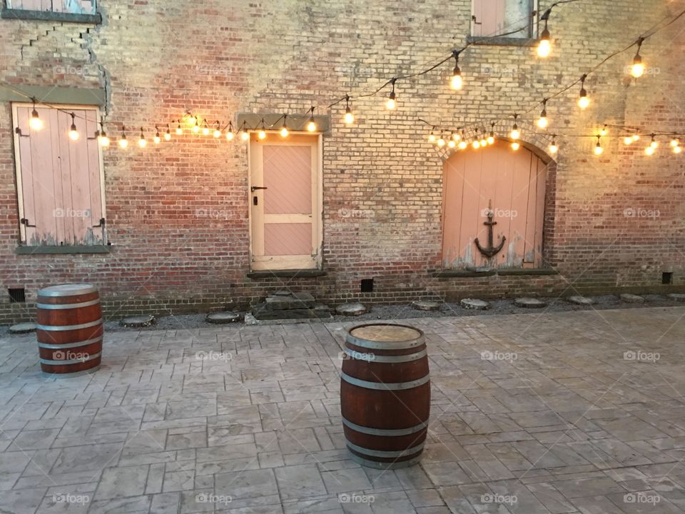 Outdoor event space decorated with string lights