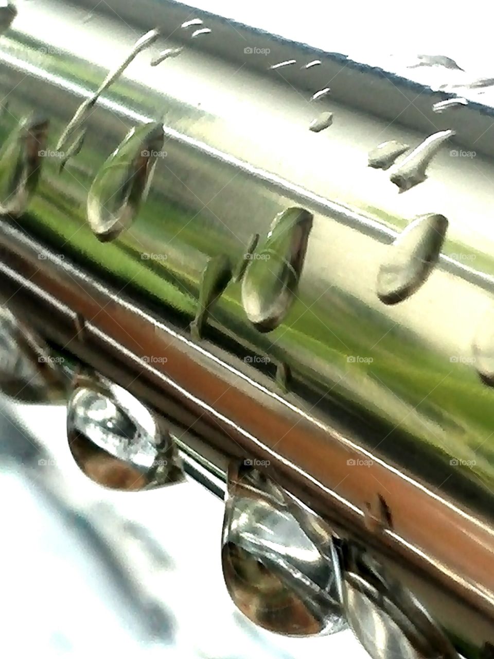 Waterdrops on a stainless pole