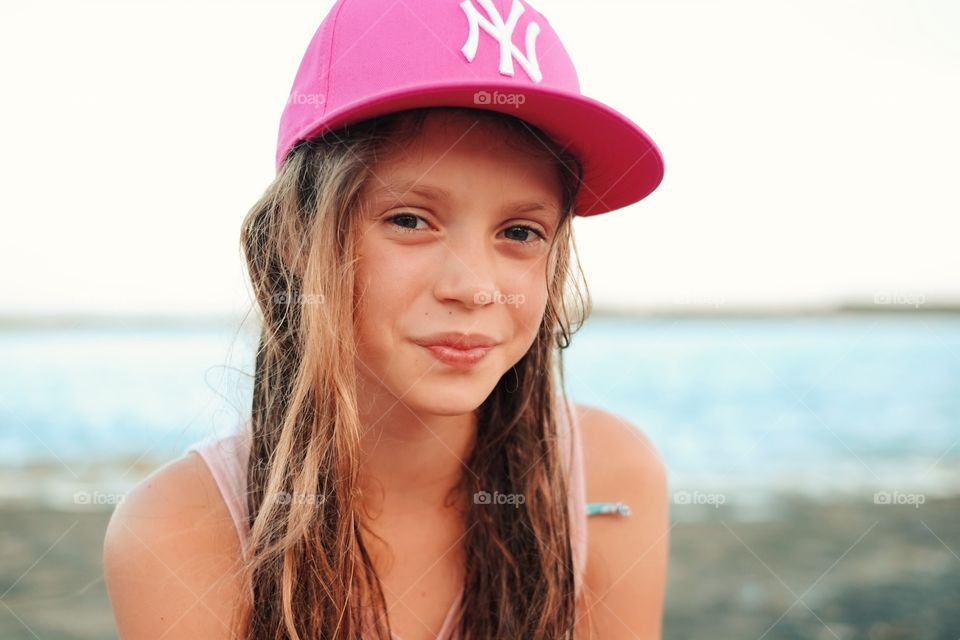 Girl enjoying the summer holiday and smiling into the camera