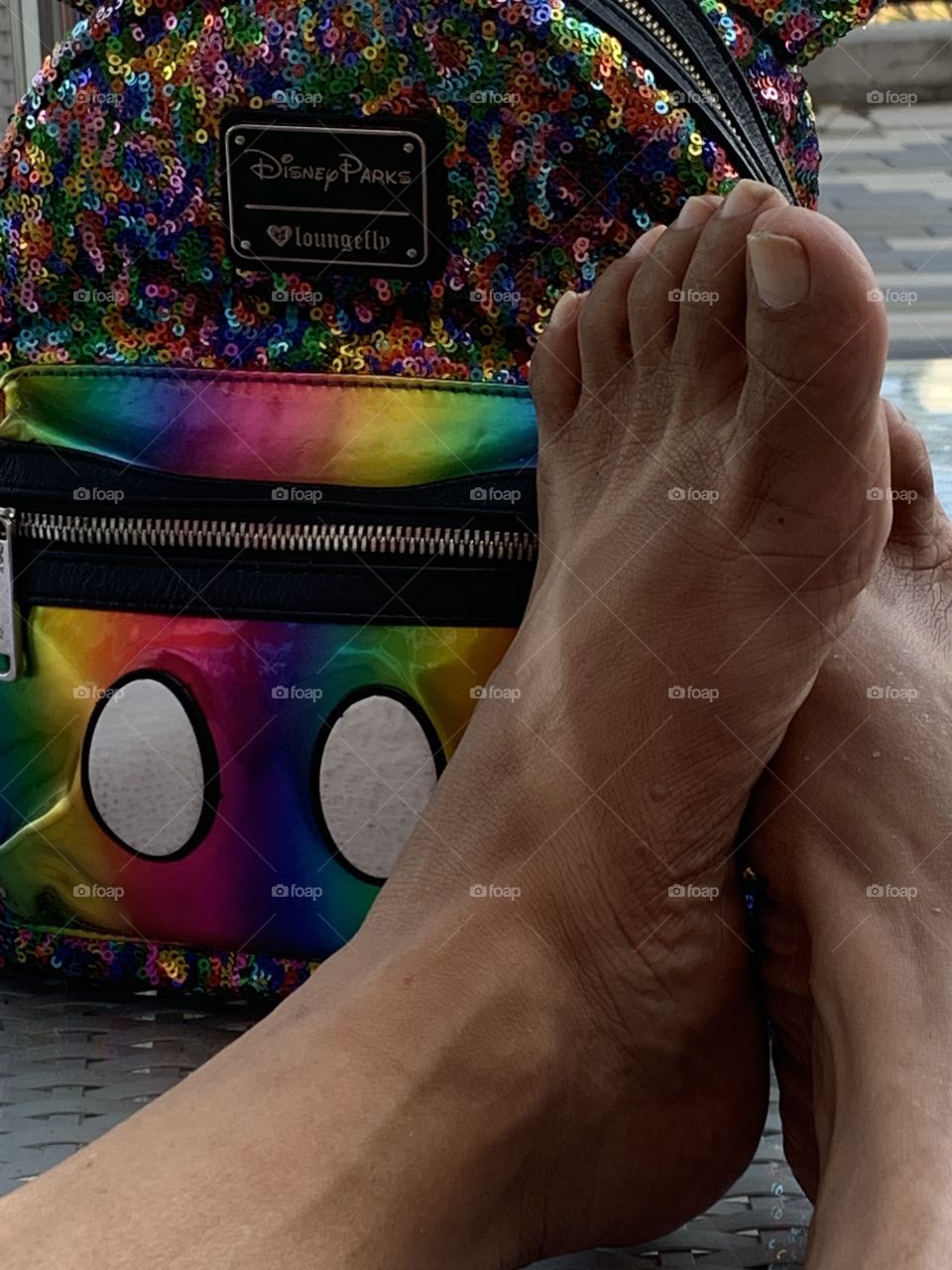 Feet with sandal tan.