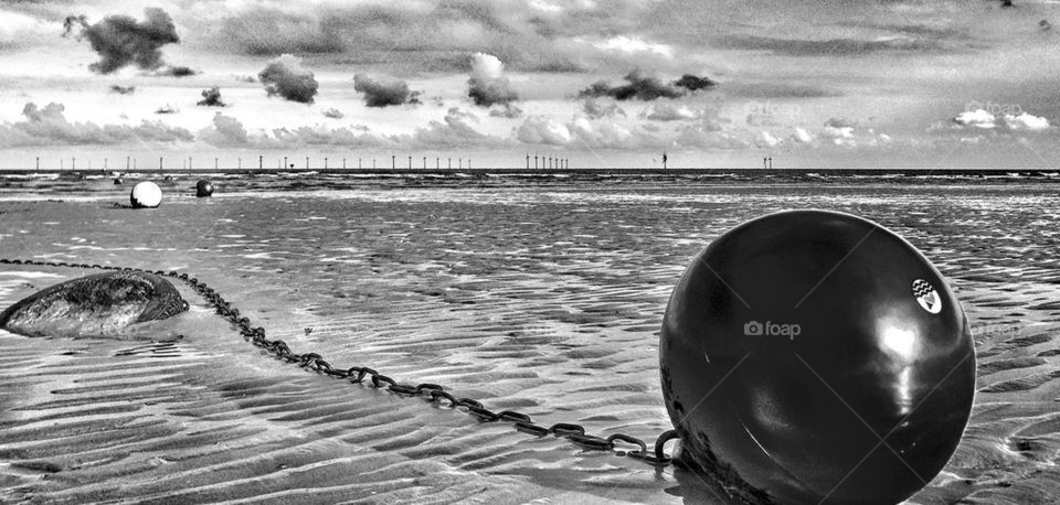 Buoy laying on beach