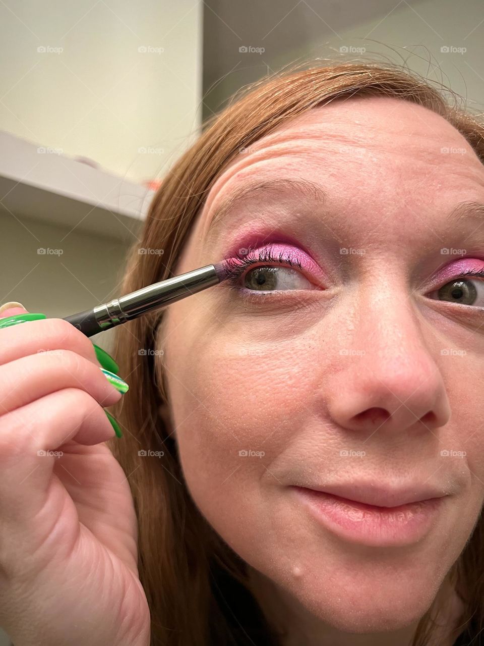 Putting on pretty bright magenta pink eyeshadow 