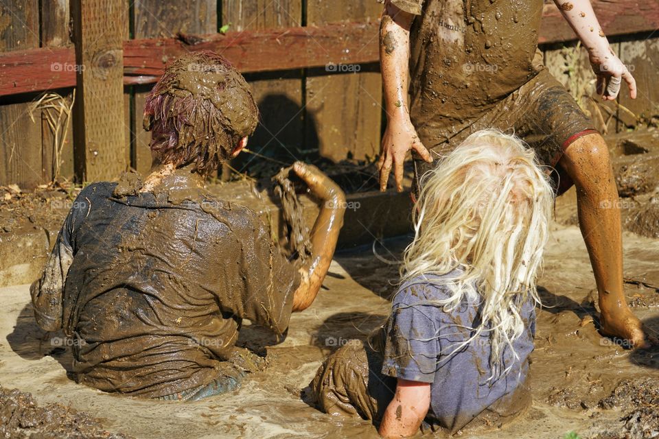 Young Boys Playing In Mud