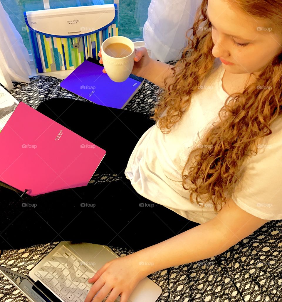 Overhead view of girl studying