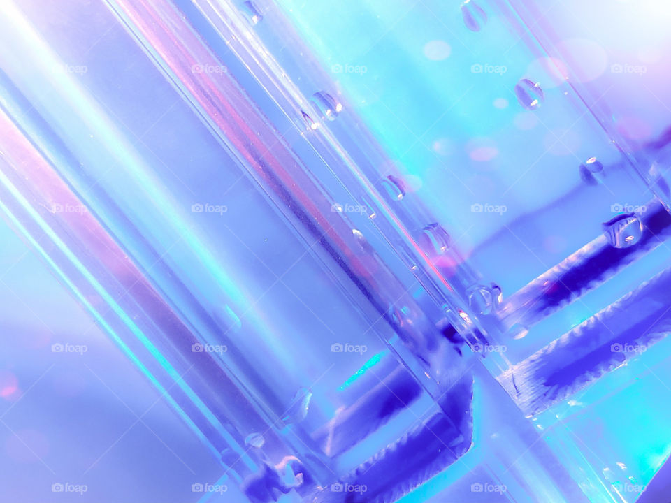 Conceptual abstract design background that is blue, aqua, and pink in color.