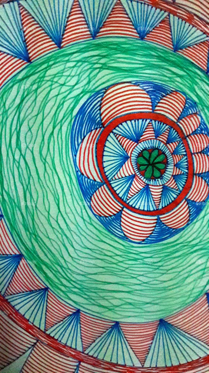 The stylised representation of the eye with colourful pens.