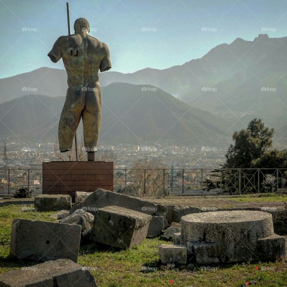 Igor Mitoraj's modern sculptures blend perfectly into ruins of Pompeii. An amazing talent in an amazing place.