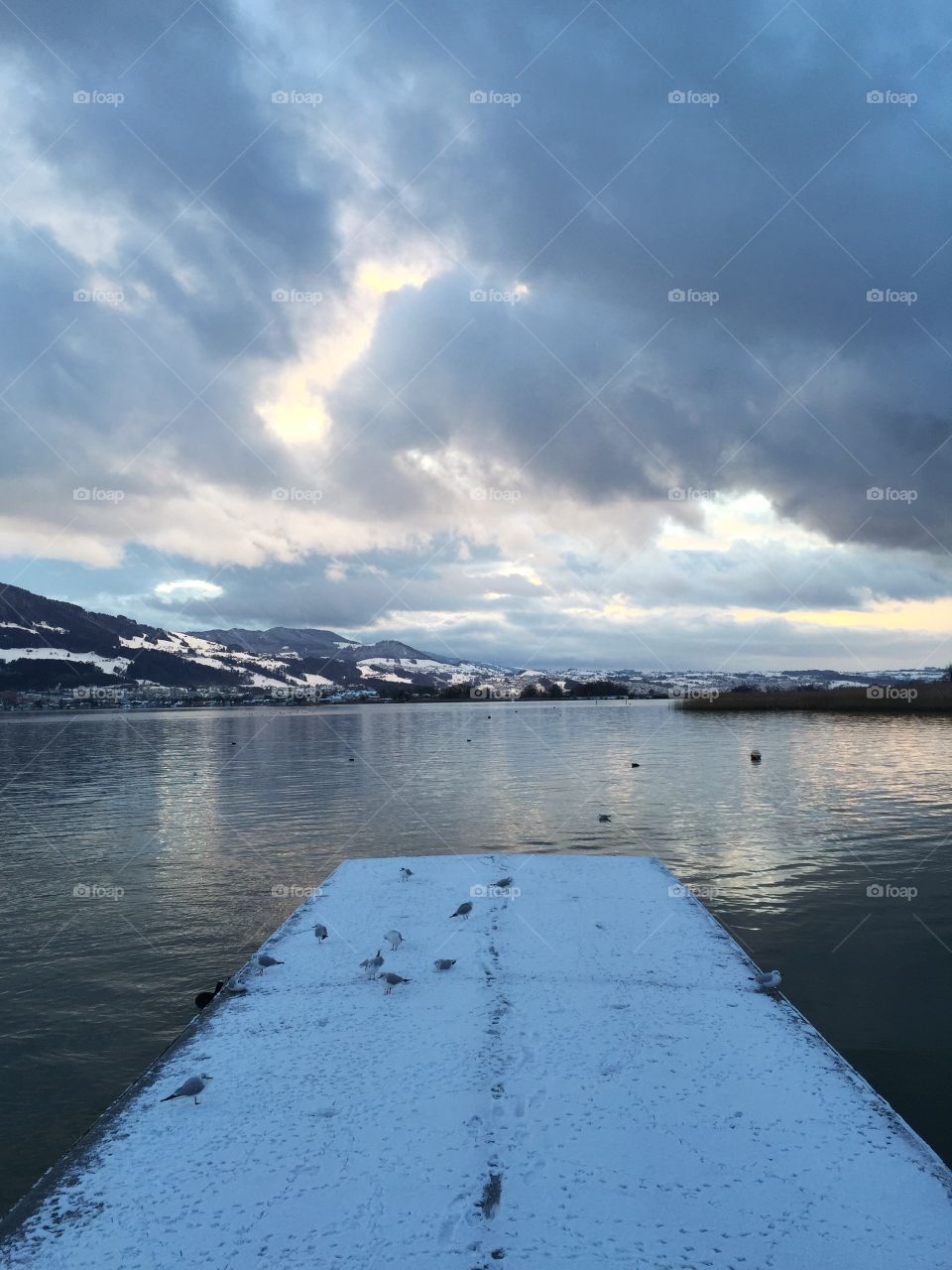 Bridge leading into the lake - with view to the other Lake side on a cold Winter day.