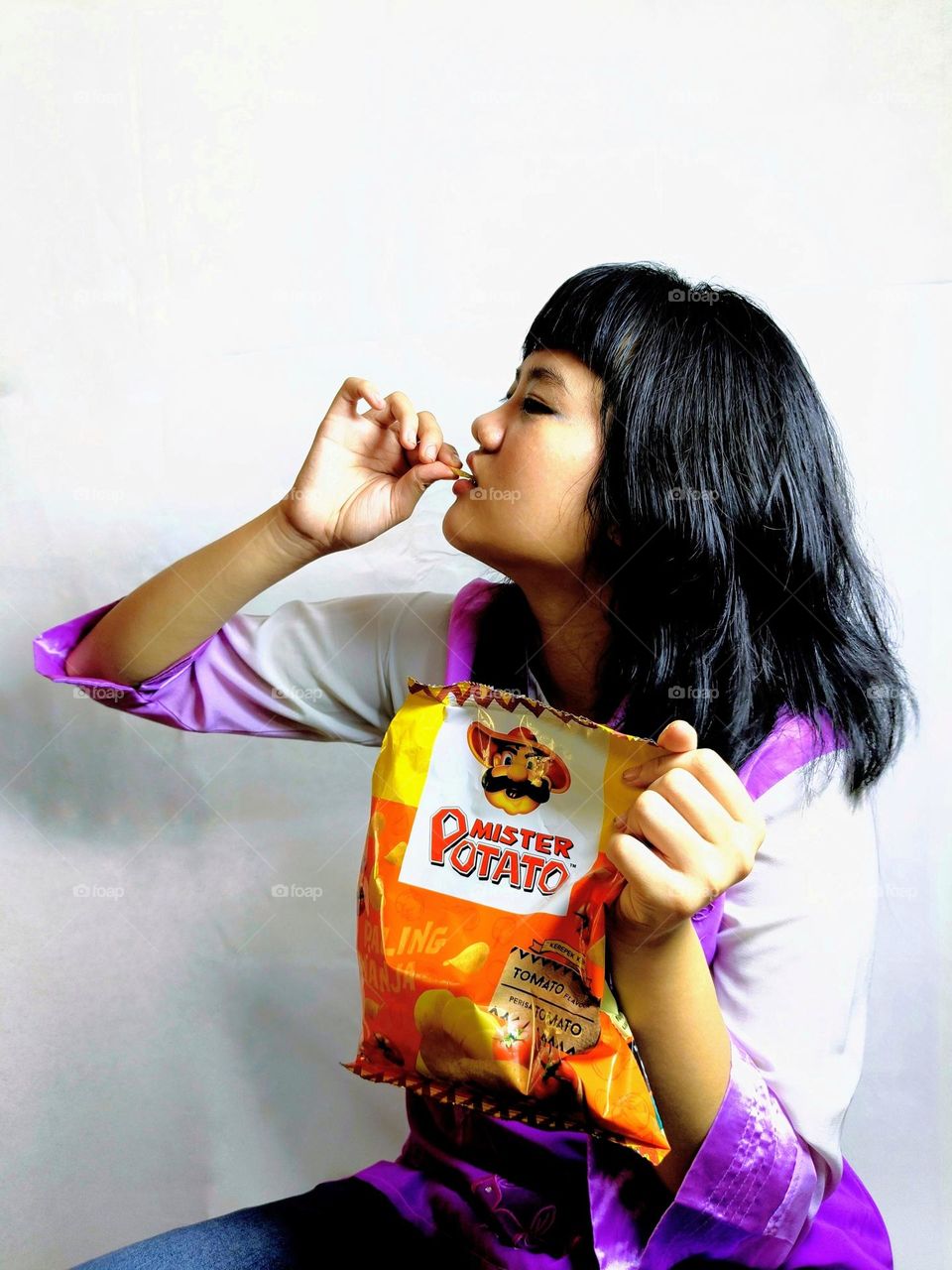 A Chinese girl with potato chips.