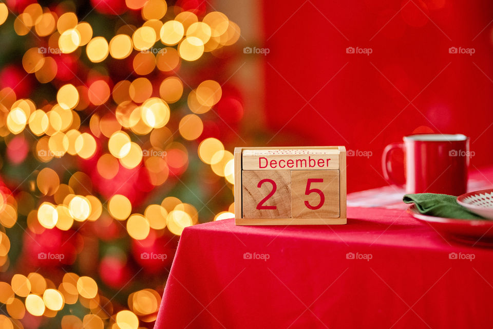 Christmas background with wooden block calendar with the date of December 25