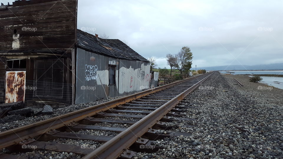 dilapidated building near the tracks