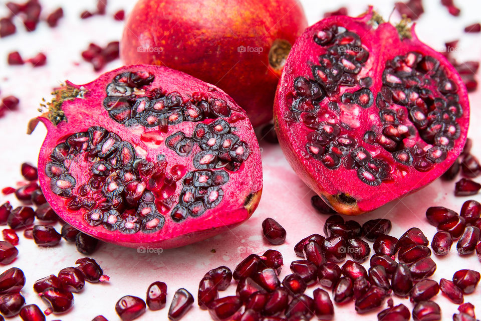 Fruit! Beautiful red pomegranate sliced and seeds with juice