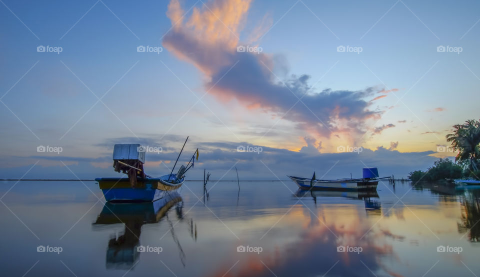 Beautiful sunrise at Jubakar Pantai Tumpat where the sea is calm and reflect like a mirror