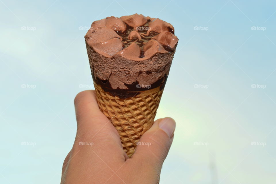 Person holding ice cream cone