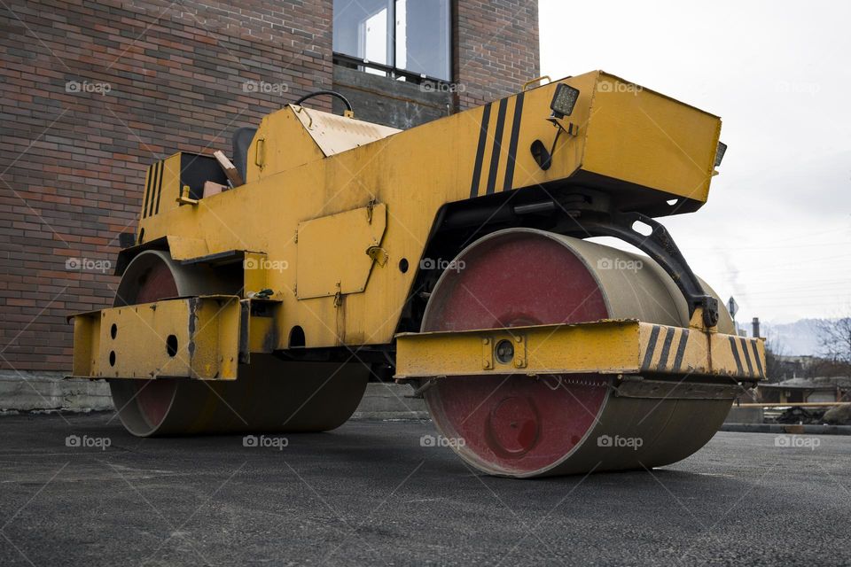 Asphalt paving machine . Asphalt road roller with heavy vibration roller compactor .