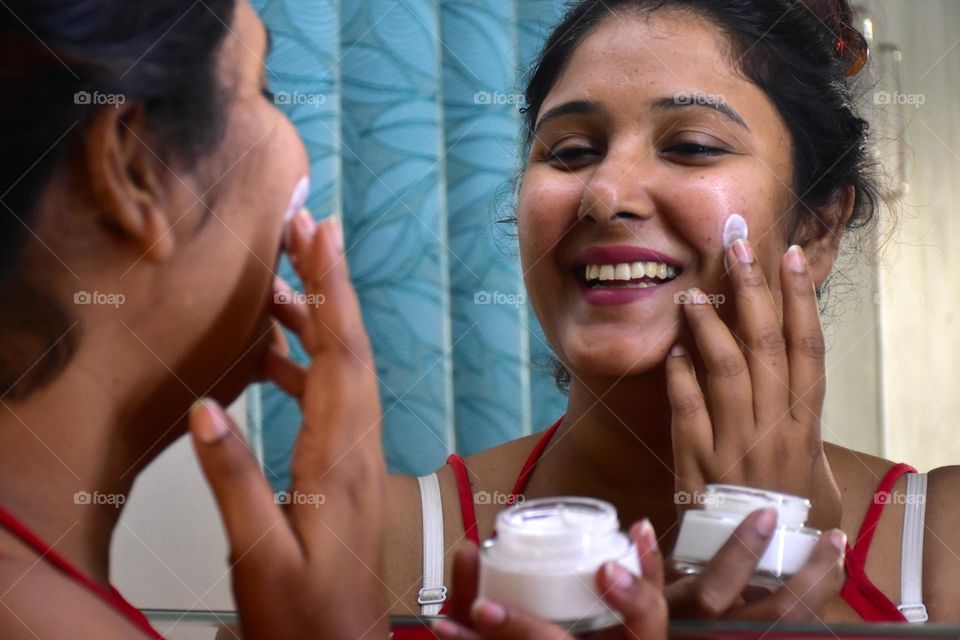 Woman applying cream