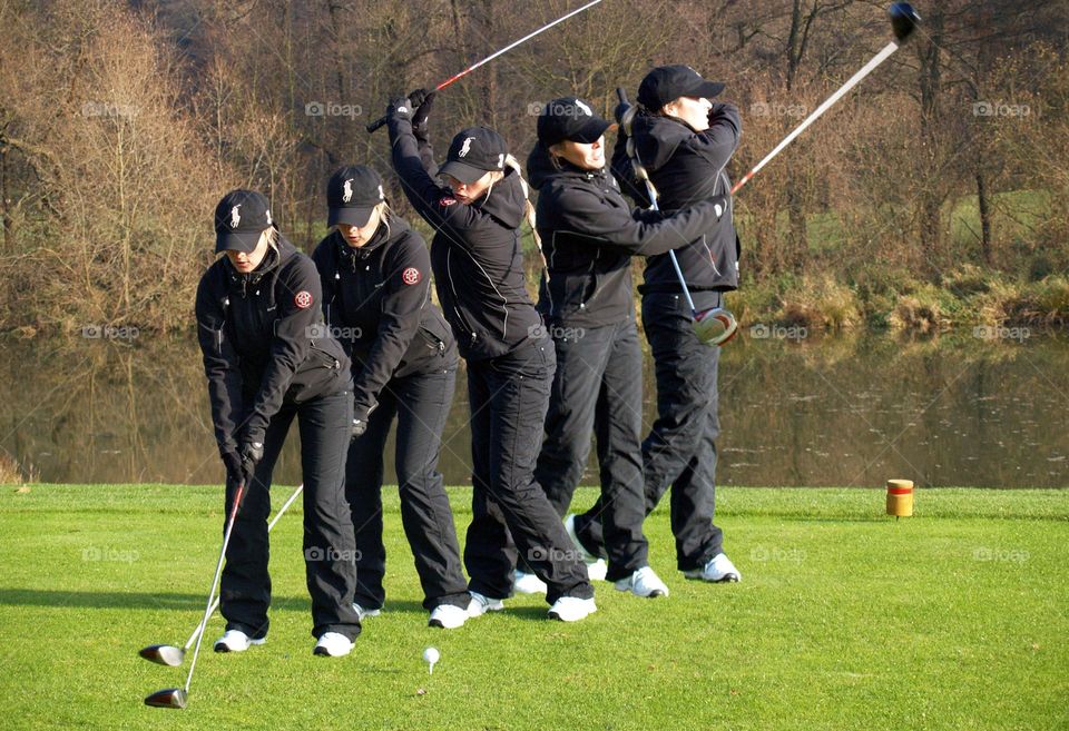 Woman practicing on golf course