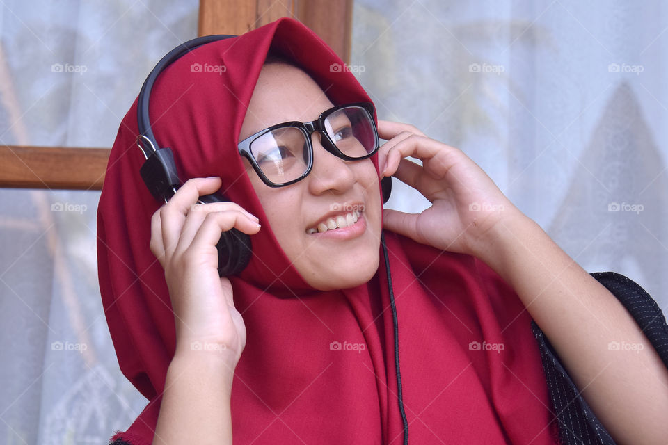 girl with headphone enjoy the music