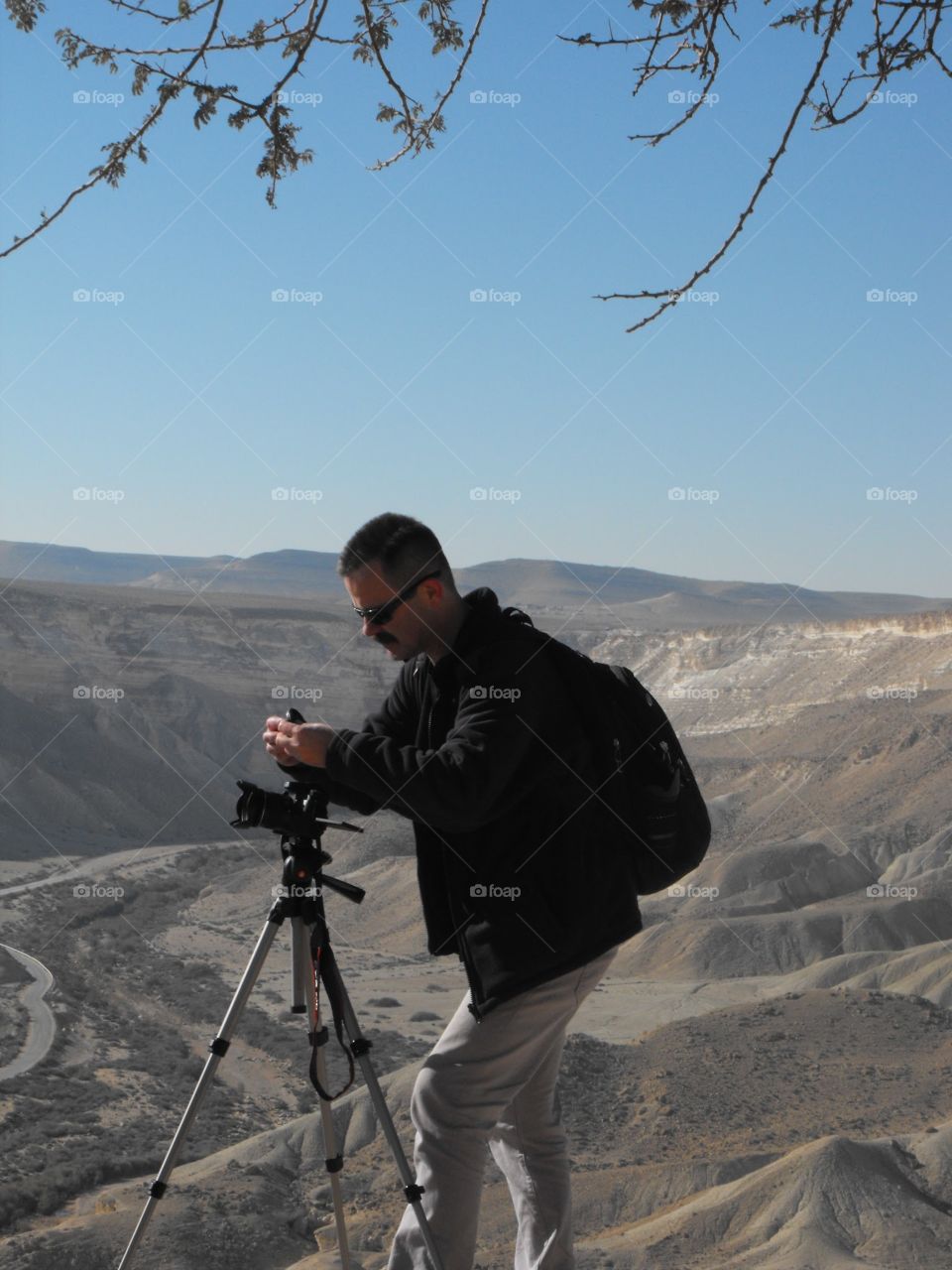 Photographer. Photographer photographing landscape in the desert