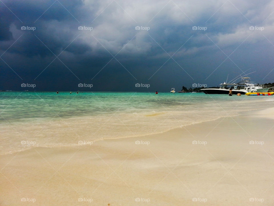 Ominous storm clouds over paradise beach