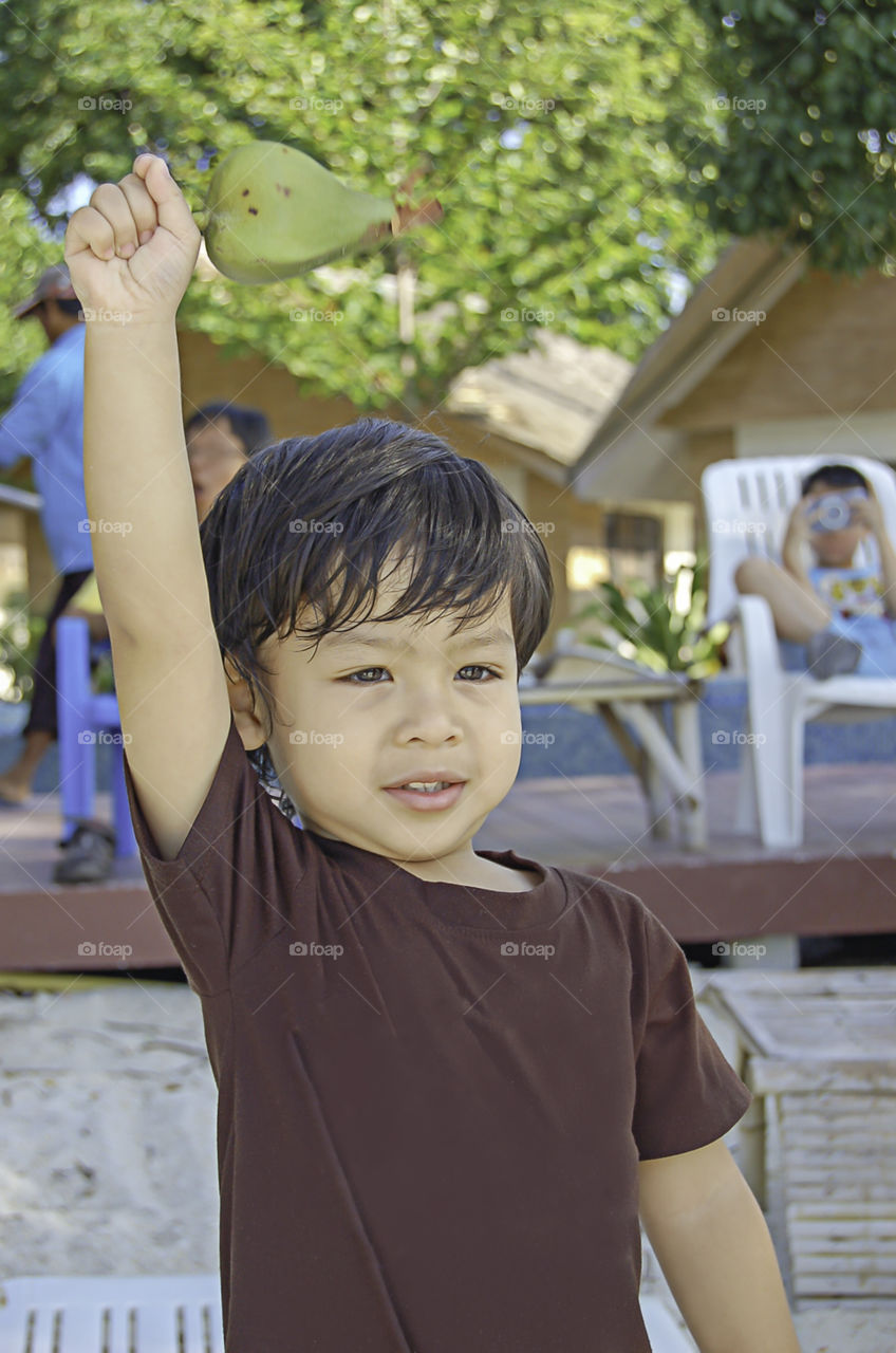 Portrait boy Sitting on the beach, Koh Lipe at Satun in Thailand.