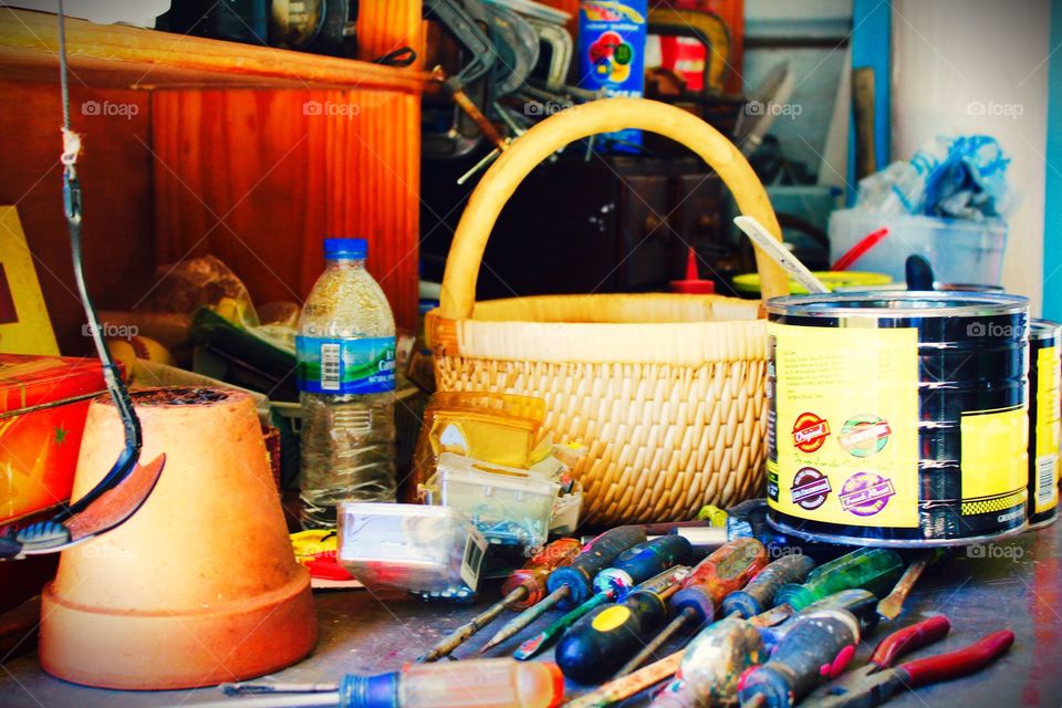 Workshop table with screwdrivers and  basket