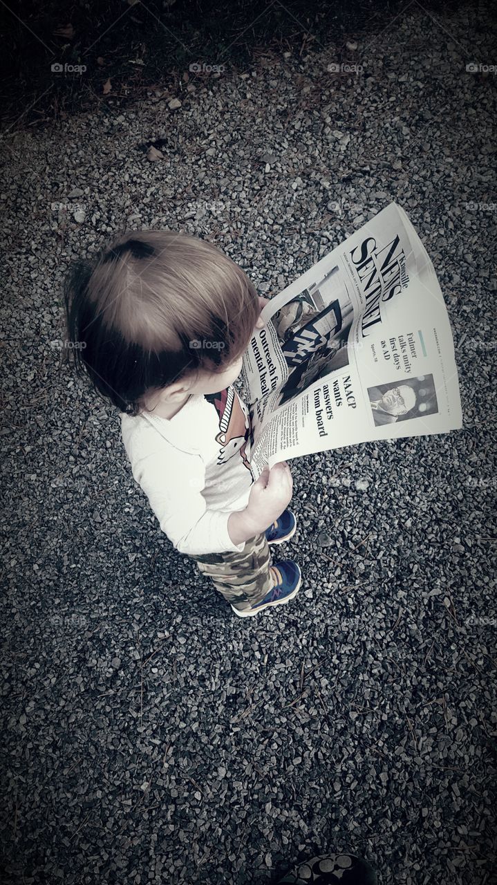 Toddler Boy Reading the Paper