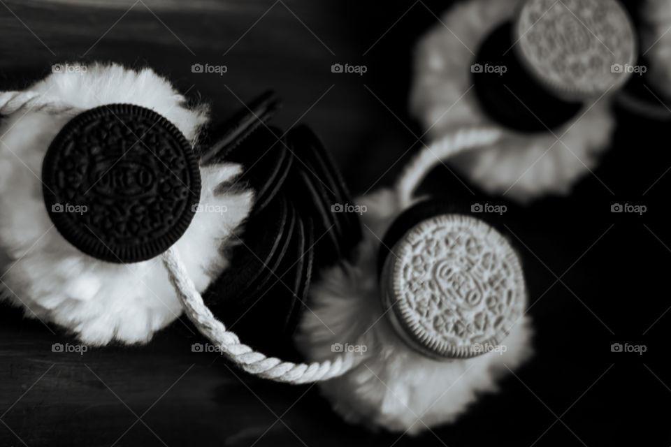 Playful Oreo Cookies Cute and fun Oreo Cookie art photography contrasts of black and white with normal and thin Oreos on pompon puffs