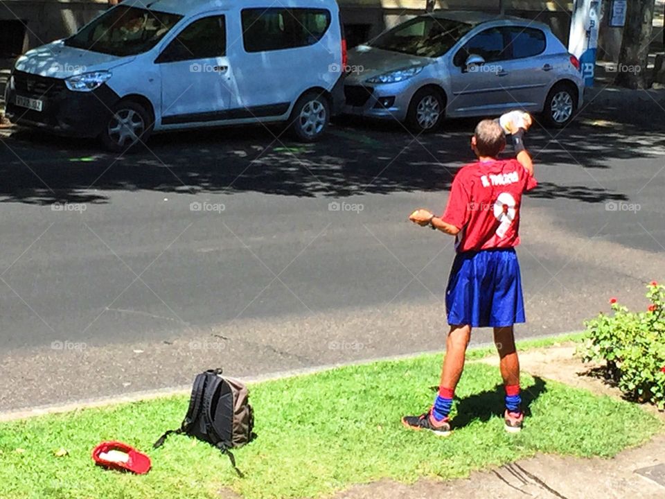 Athletic man by the road 