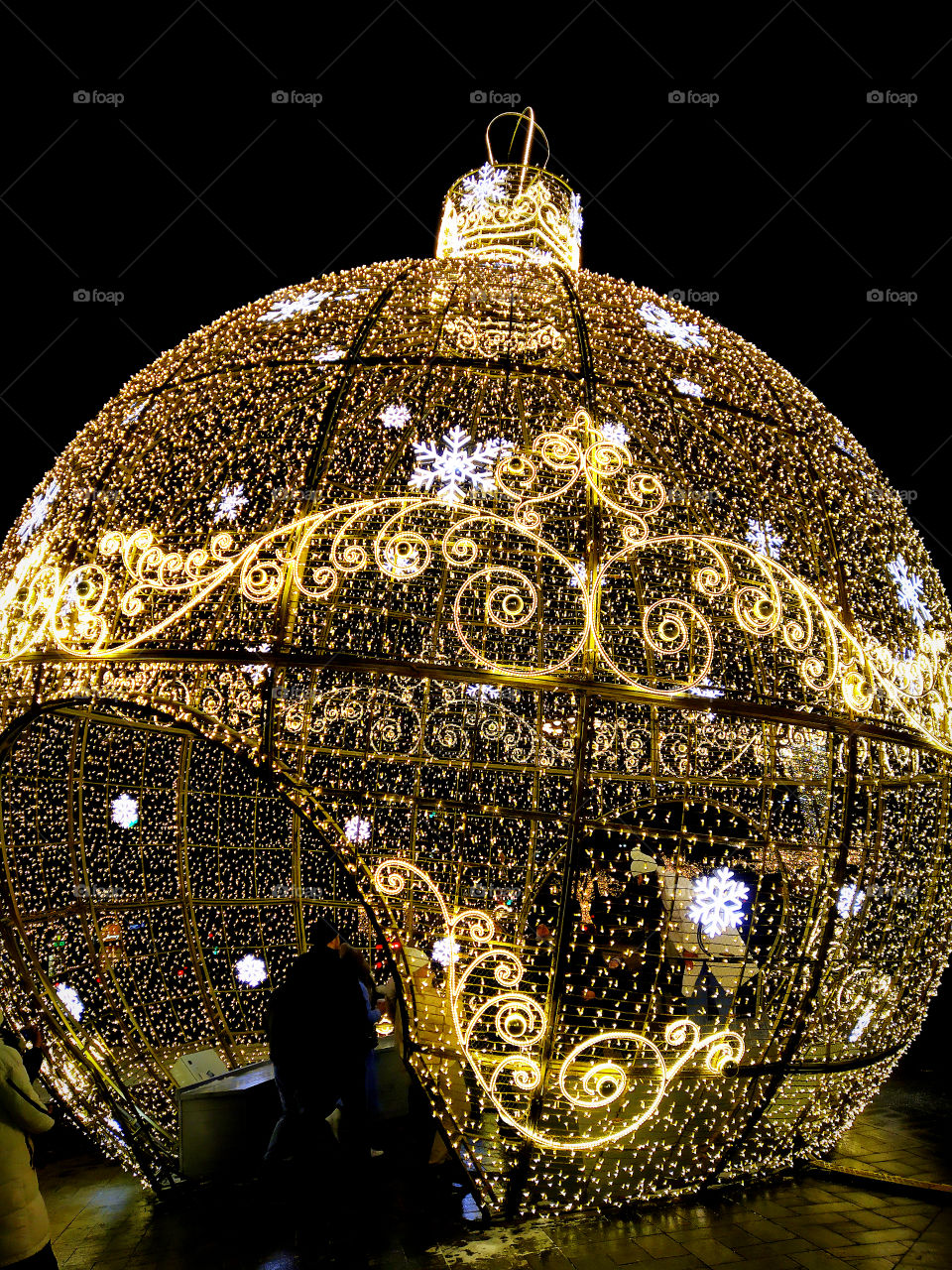 Moscow in the evening.  New Year street decorations.  A huge Christmas ball made of glowing garlands in front of the Bolshoi Theater