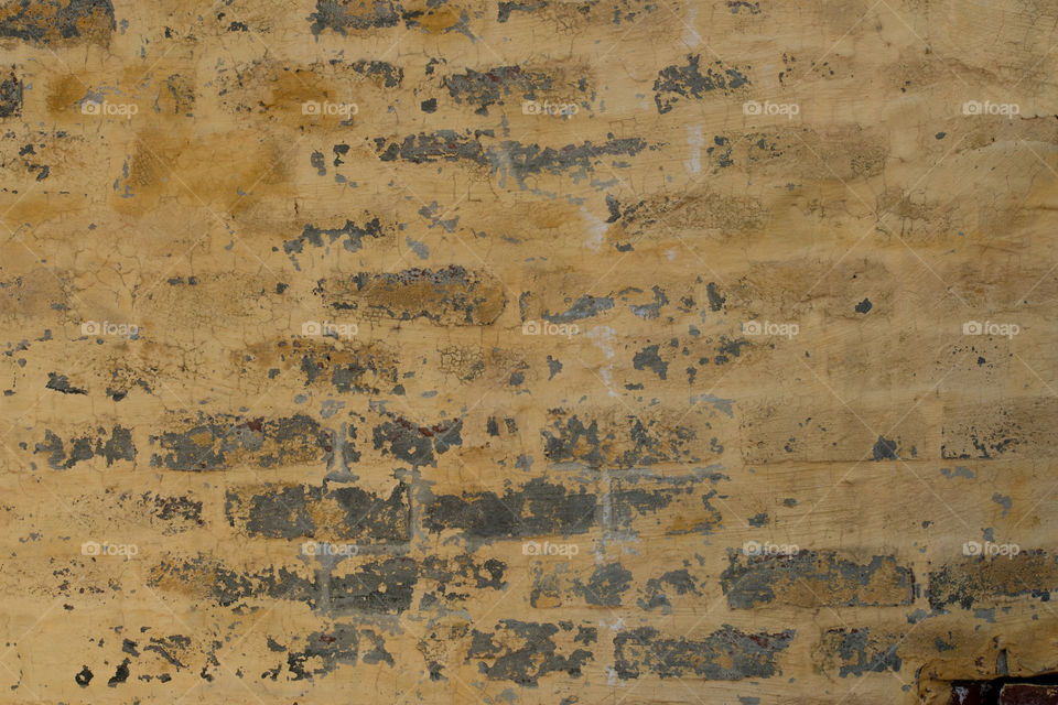 Yellow color Grungy Brick wall texture background