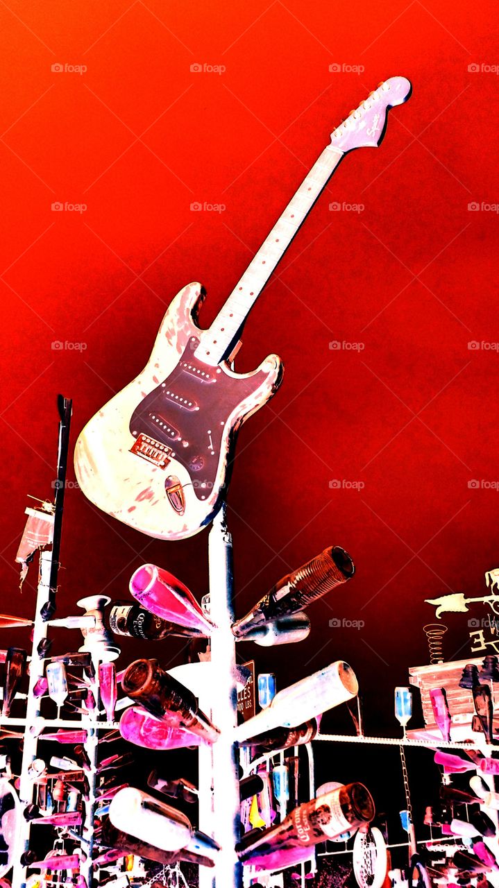 Red sky guitar. Bottle Tree Ranch on Route 66