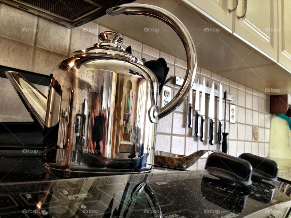 TEAPOT ON STOVE RANGE