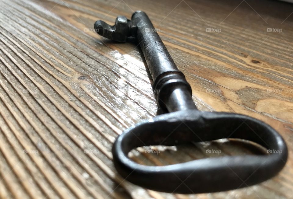 Old key on the wood 