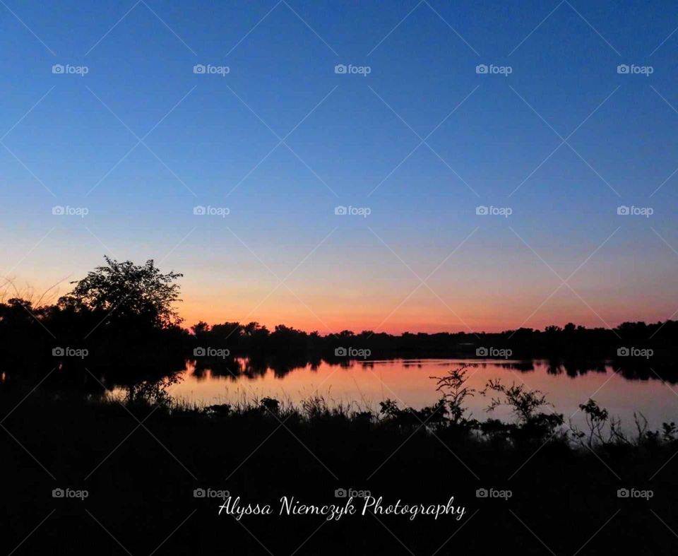 Colorful sunset. Catching all the color changes within. Crystal clear waters reflect the sky above.