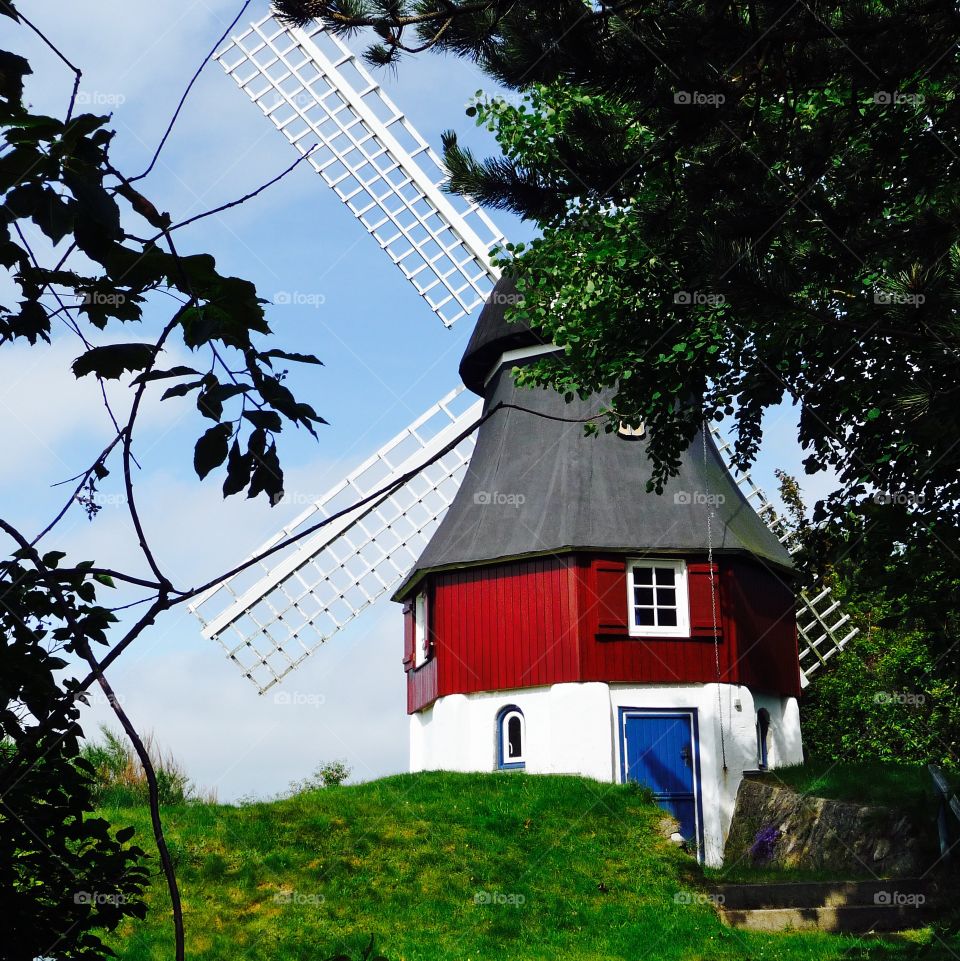 Old windmill against sky